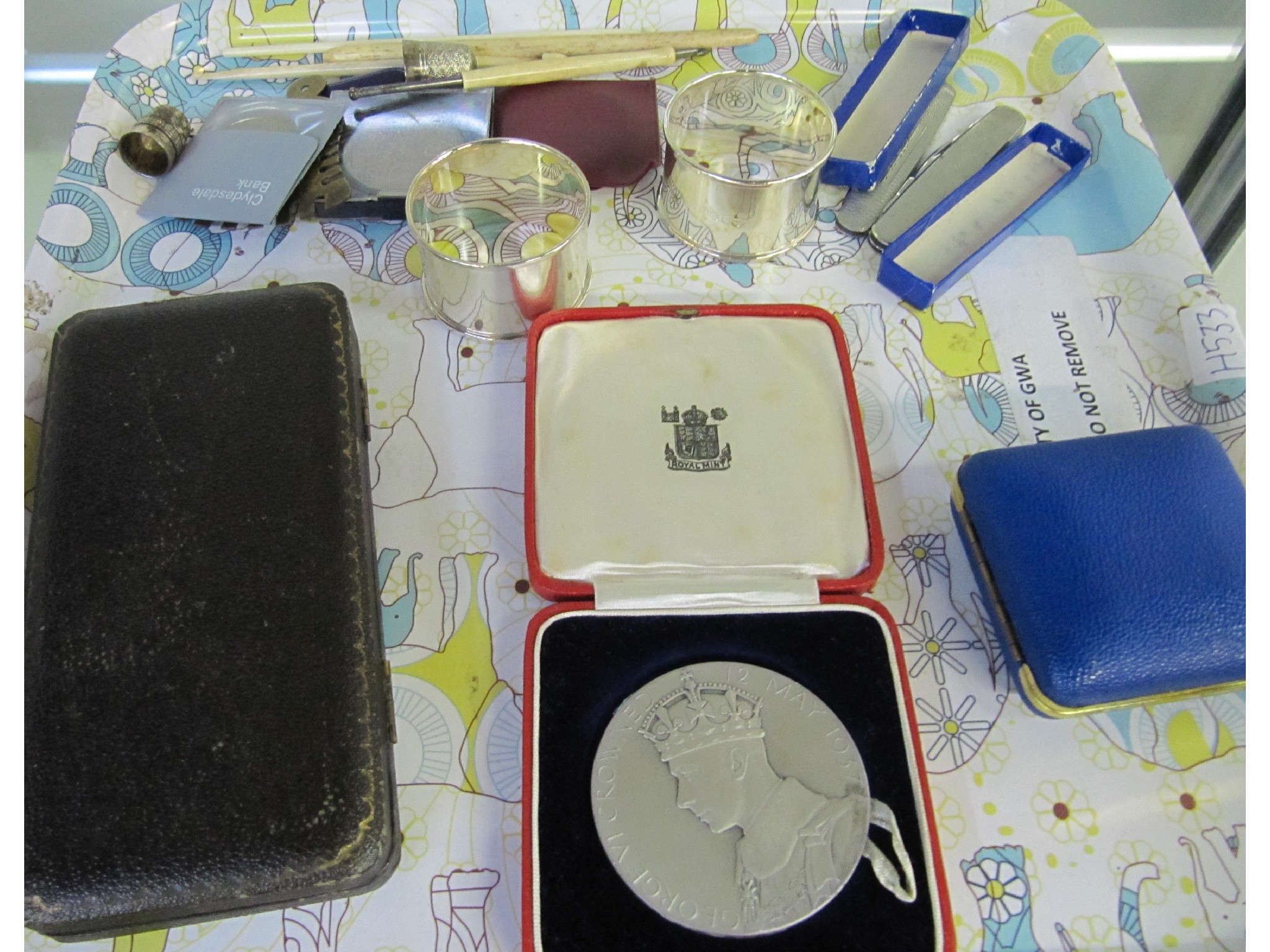 Appraisal: A tray lot of miscellania - coronation medal napkin rings