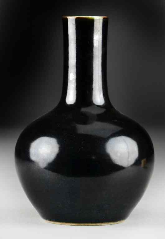 Appraisal: Chinese Monochrome Black Porcelain VaseOf bottle form raised on short