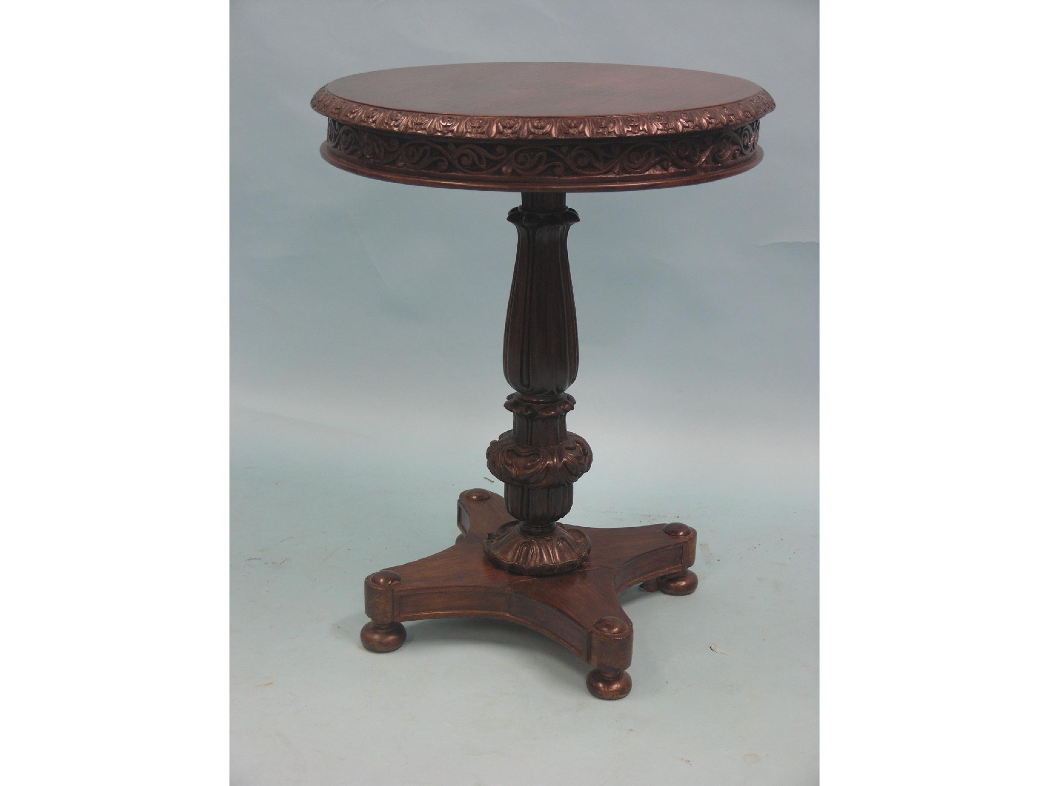 Appraisal: A mid th century rosewood occasional table circular top with