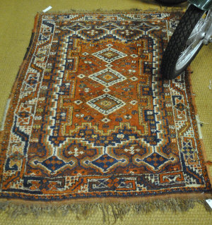 Appraisal: An old Persian Shiraz rug red ground x m