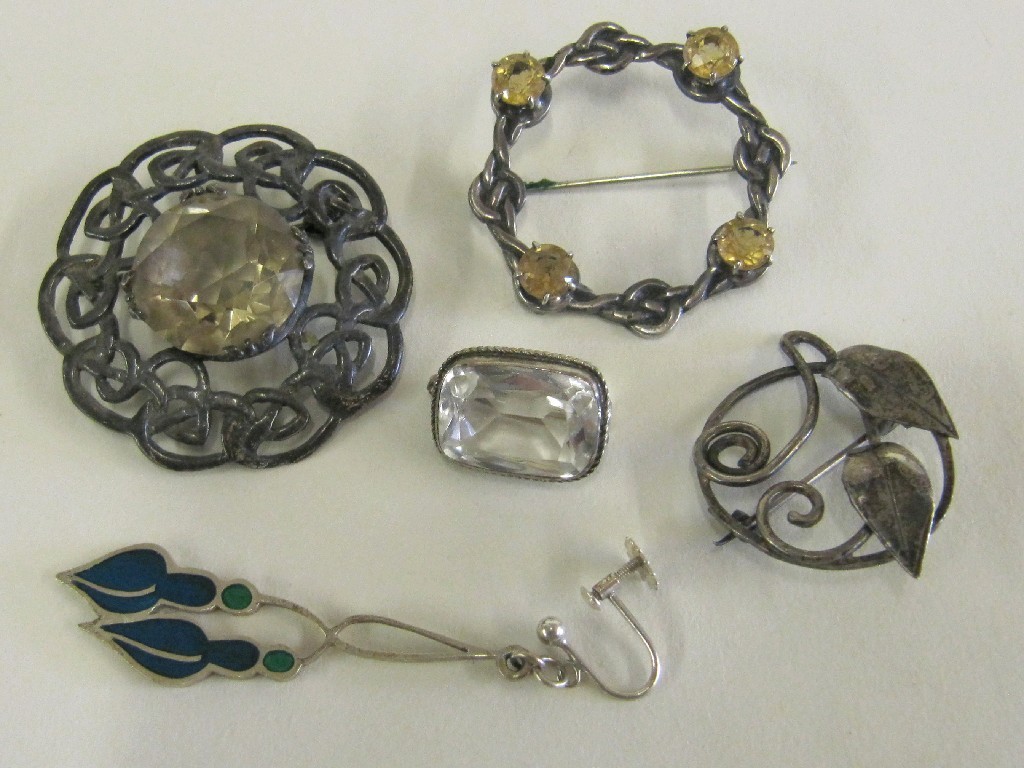 Appraisal: Lot comprising two Celtic silver knotwork brooches set with topaz