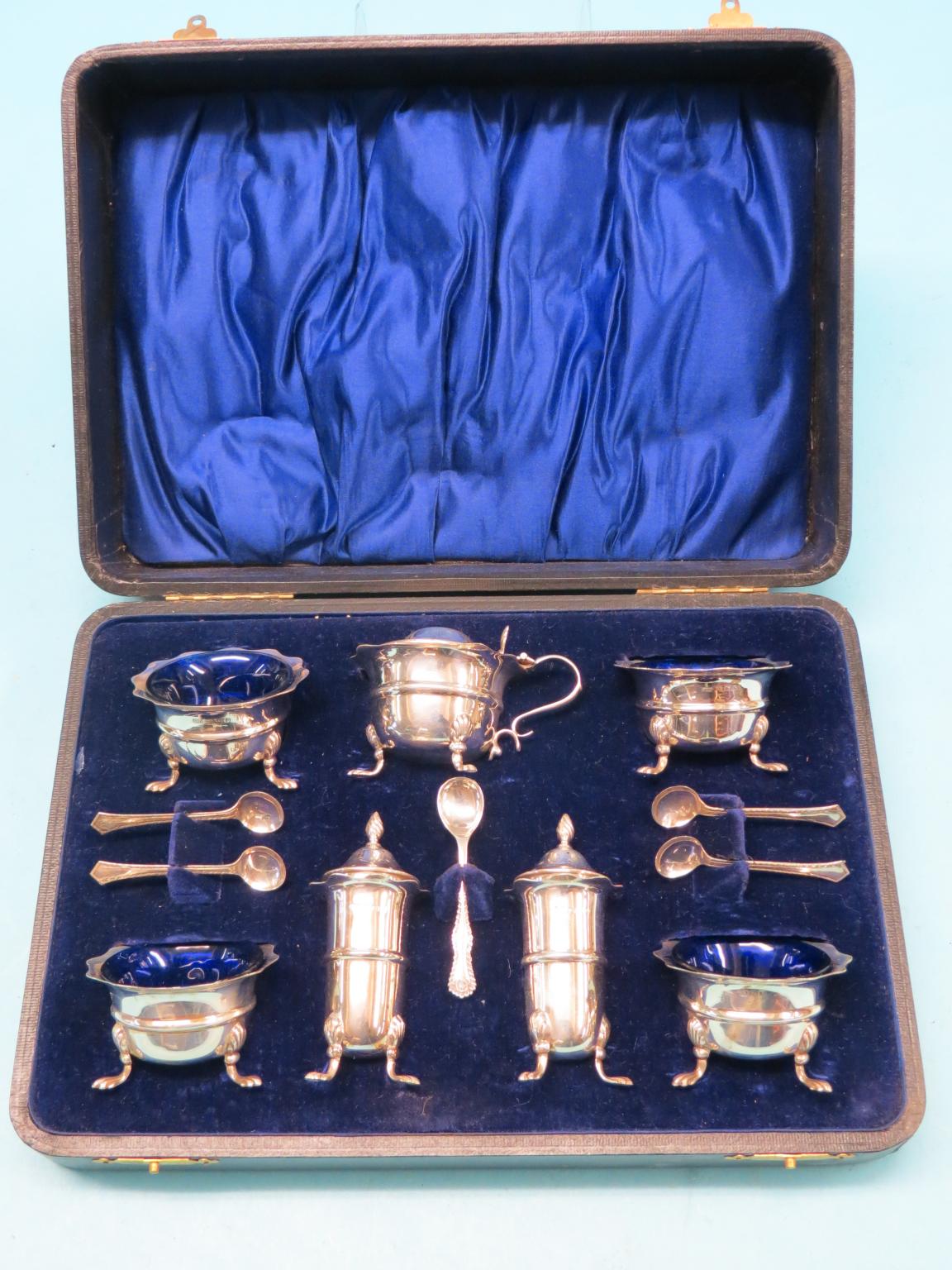 Appraisal: A silver condiment set consisting of four salts mustard pot