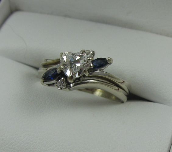 Appraisal: HEART-CUT DIAMOND SAPPHIRE AND FOURTEEN KARAT WHITE GOLD RING Estimated