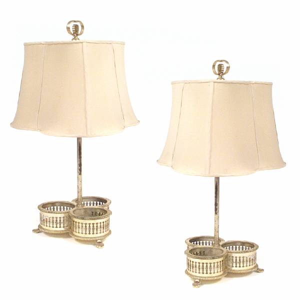 Appraisal: A pair of silver plated wine holder form table lamps