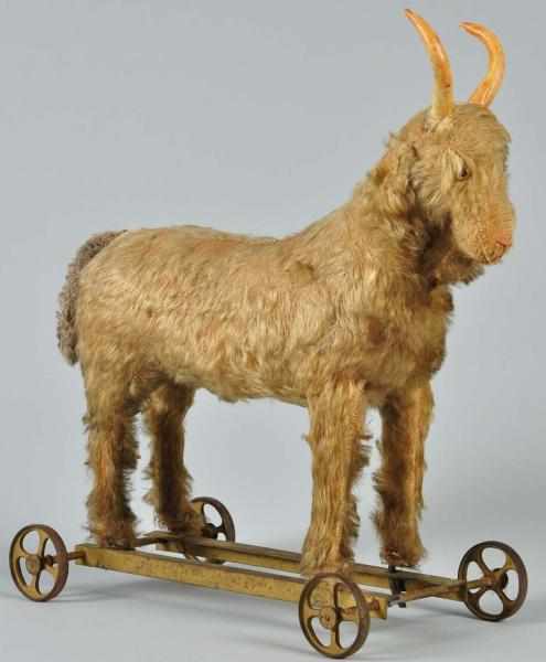 Appraisal: Large Mohair-Covered Goat Child's Pull Toy Description On metal base