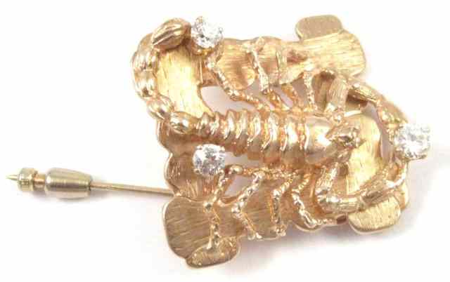 Appraisal: DIAMOND AND FOURTEEN KARAT GOLD SCORPION BROOCH featuring the full