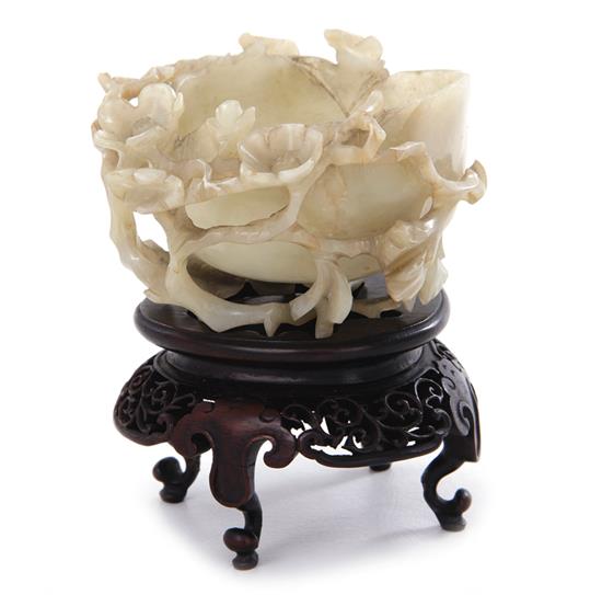 Appraisal: Chinese carved jade water coupe Qing or Republic period blossom-form