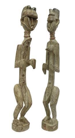 Appraisal: lot of Carved tribal male and female fertility sculptures in