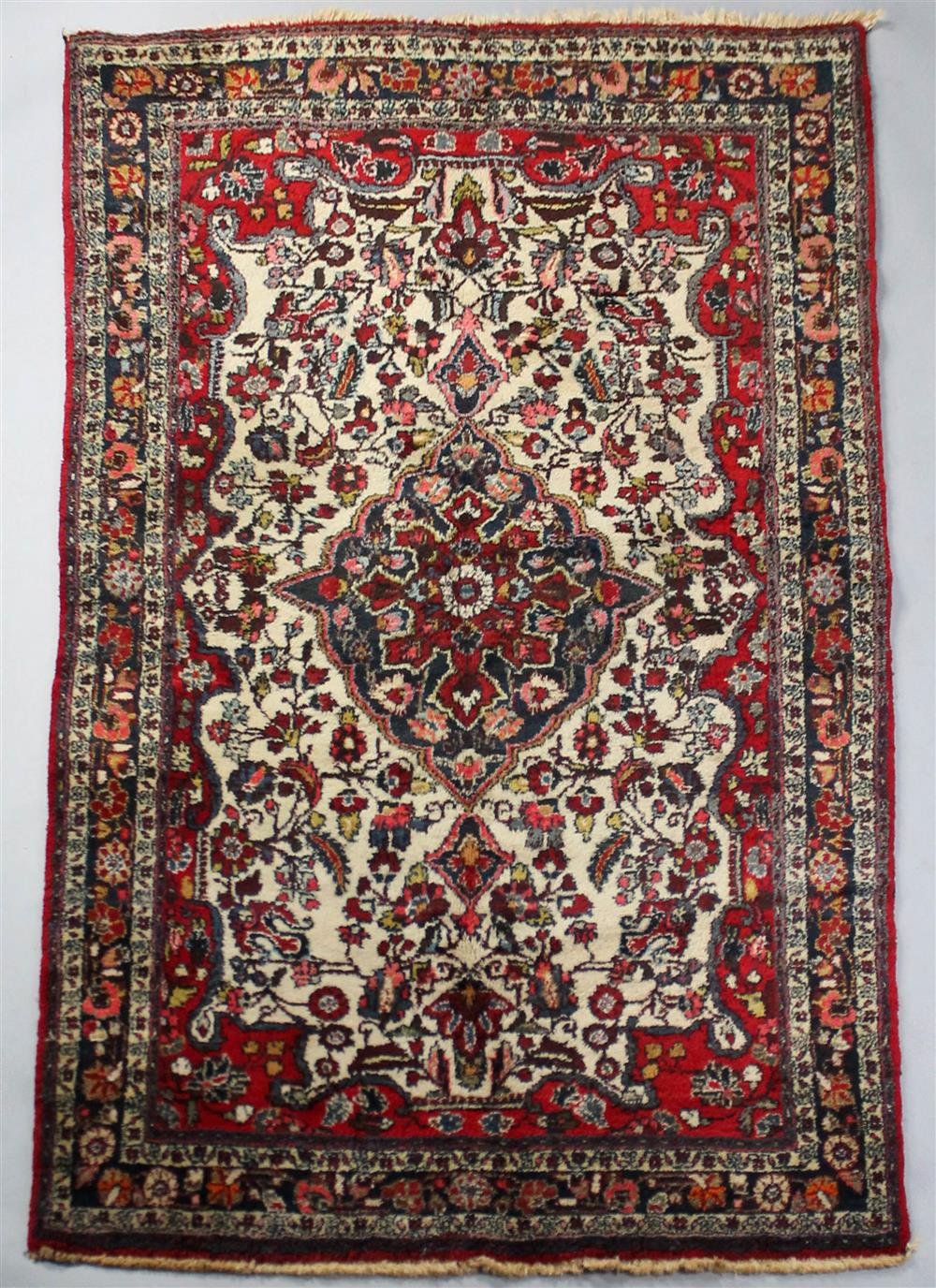 Appraisal: IRANIAN HERIZ WOOL RUG having a central medallion with teardrops