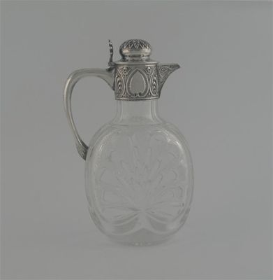 Appraisal: A Victorian mounted cut-glass claret jug with lobed body embossed