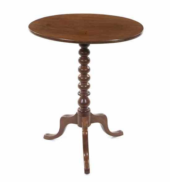 Appraisal: An American Cherry Tilt-Top Tea Table having an oval top