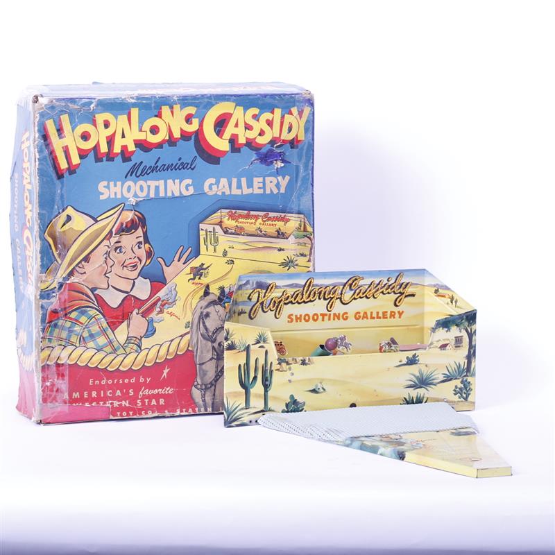 Appraisal: Hopalong Cassidy Mechanical tin litho toy shooting gallery with box