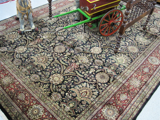 Appraisal: HAND KNOTTED ORIENTAL CARPET Persian Sarouk design of flowers covering