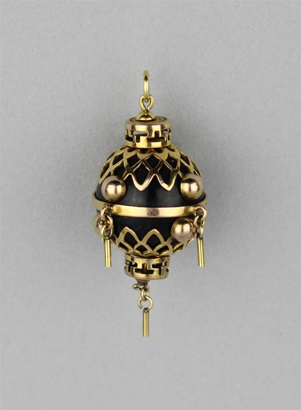 Appraisal: K YELLOW GOLD AZABACHE PENDANT the good luck pendant is