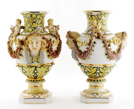 Appraisal: Pair Continental porcelain mantel vases urn-forms decorated with molded masks