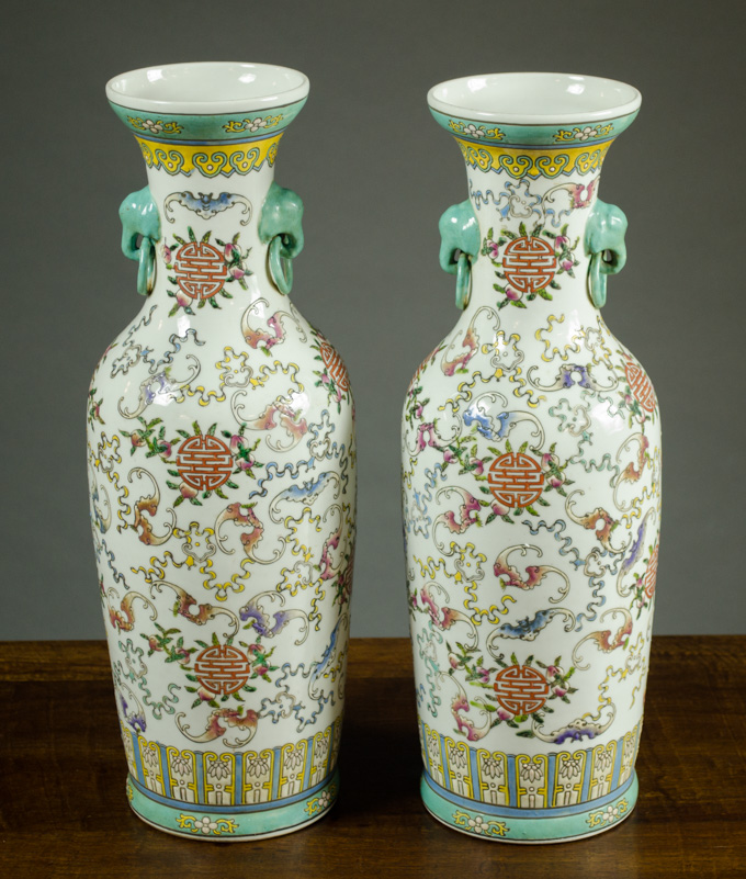 Appraisal: PAIR OF QING STYLE DOUCAI PORCELAIN VASES with flanking elephant