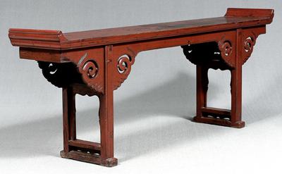 Appraisal: Chinese red lacquer altar table upturned ends cloud head aprons