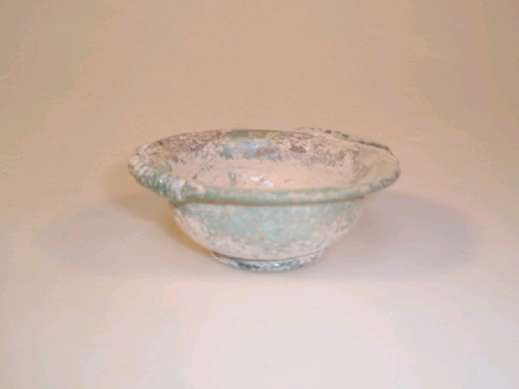 Appraisal: A small Roman pale bluish-green glass dish the wide flaring