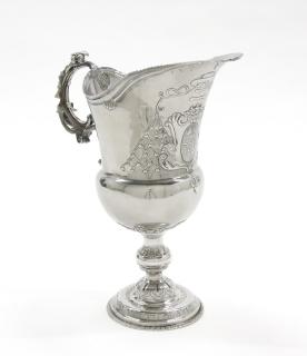 Appraisal: A SILVER-PLATE ARMORIAL PEDESTAL PITCHER Probably th Century With an