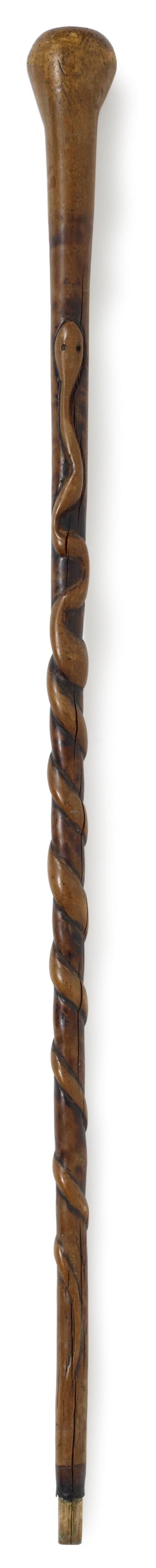 Appraisal: Carved maple snake canemid th century