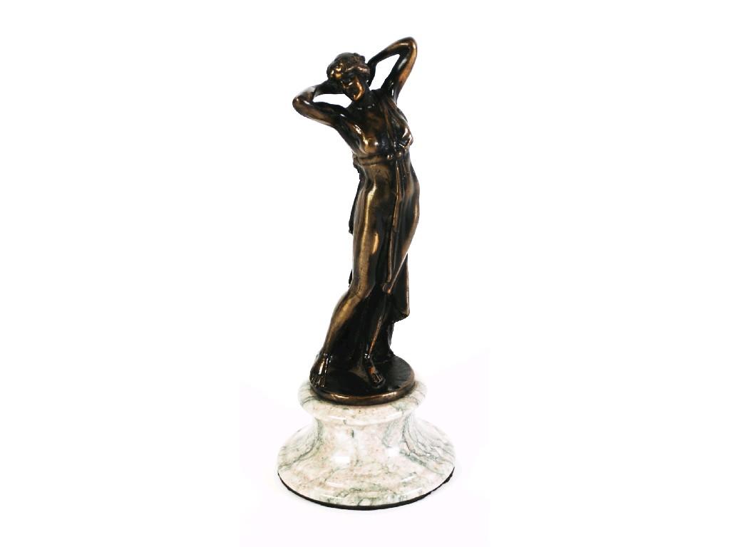 Appraisal: MODERN PATINATED BRONZE FIGURE modelled as a semi naked female