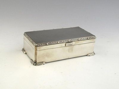 Appraisal: A modern oblong cigarette box with canted corners with applied