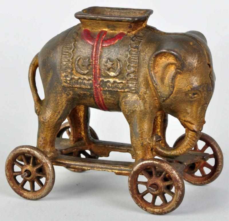 Appraisal: Cast Iron Elephant on Wheels Still Bank Manufactured by AC