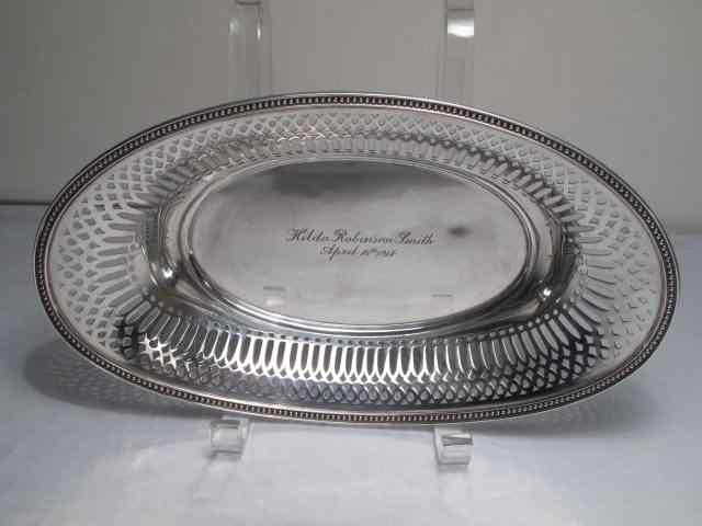 Appraisal: An oval sterling silver oval bowl with reticulated rim and