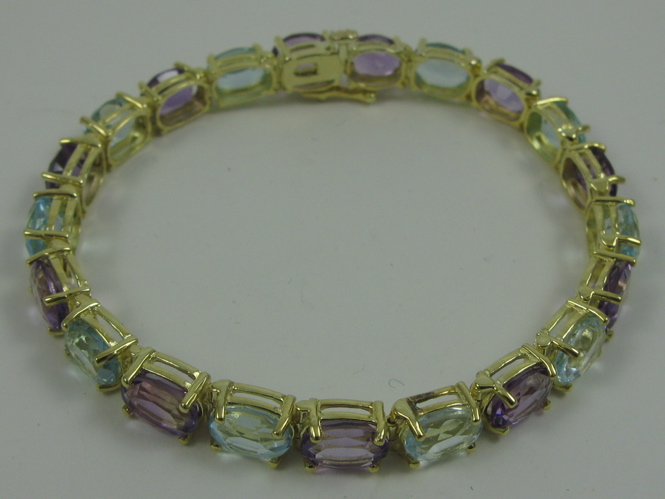 Appraisal: AMETHYST BLUE TOPAZ AND FOURTEEN KARAT GOLD BRACELET in length