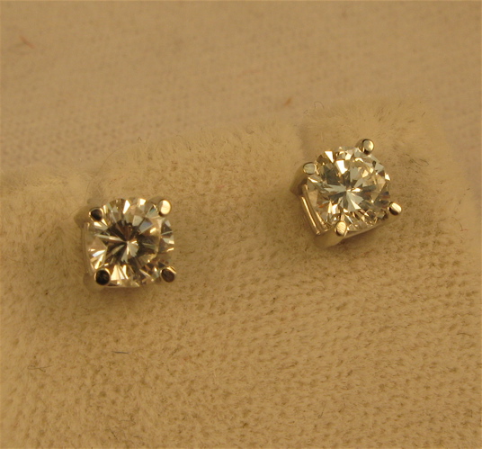 Appraisal: PAIR OF DIAMOND AND FOURTEEN KARAT WHITE GOLD EAR STUDS