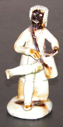 Appraisal: Title Seated Bubbsley Staffordshire stone ware figure of a Black