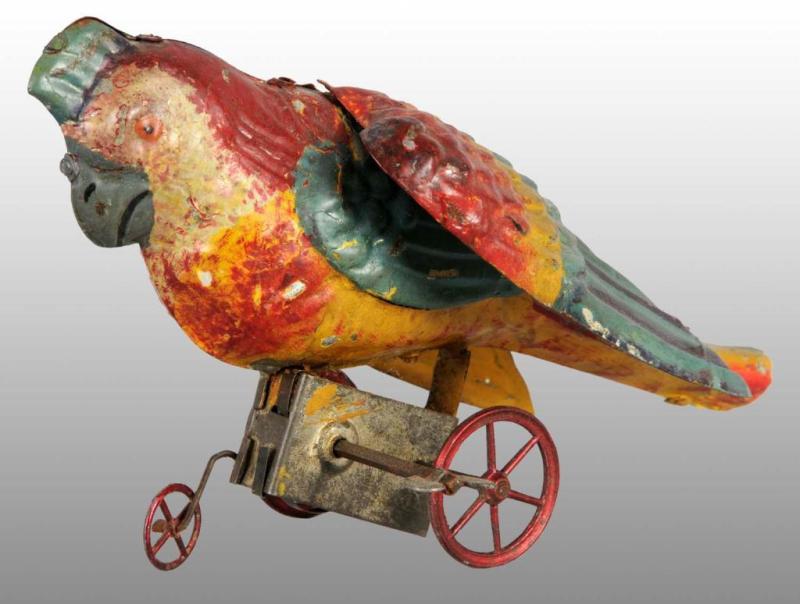 Appraisal: Tin Hand-Painted Parrot Wind-Up Toy Description German Working Beautiful tri-colored