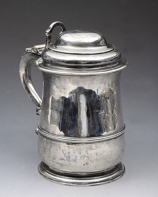 Appraisal: A GEORGE II SILVER LIDDED TANKARD of baluster form with