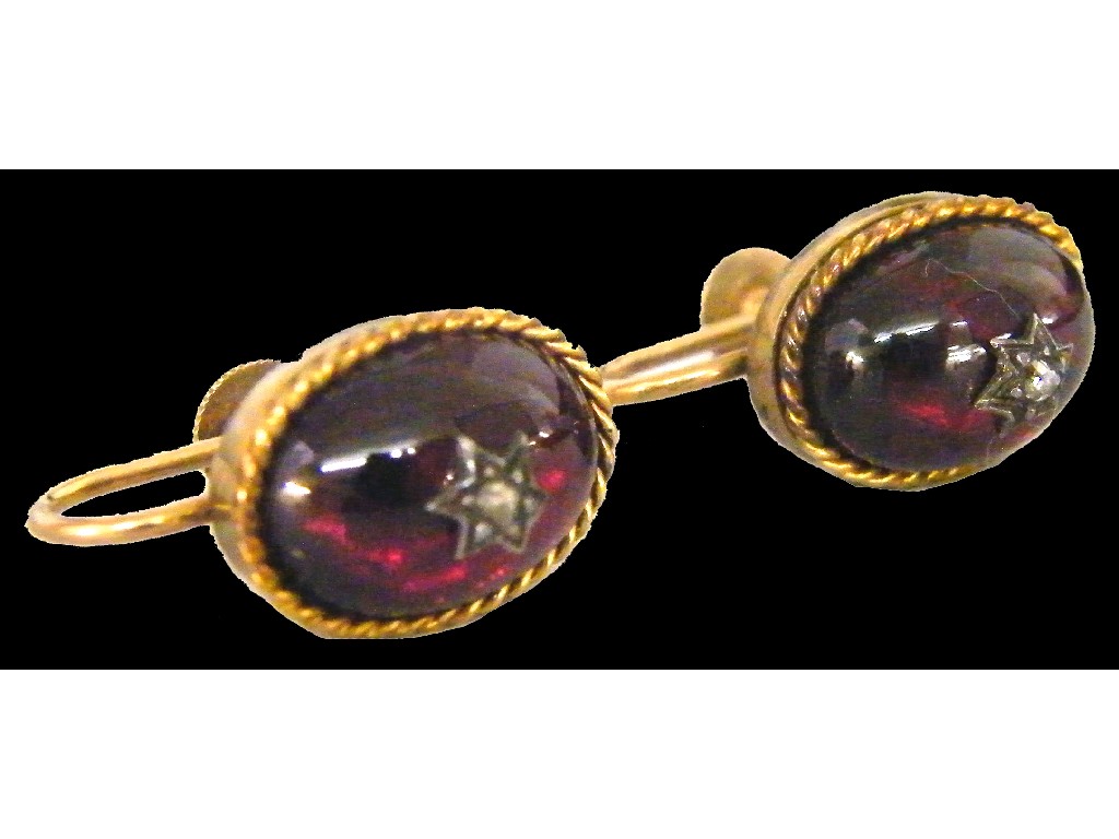 Appraisal: Pair of ct cabouchon garnet and diamond earrings in an