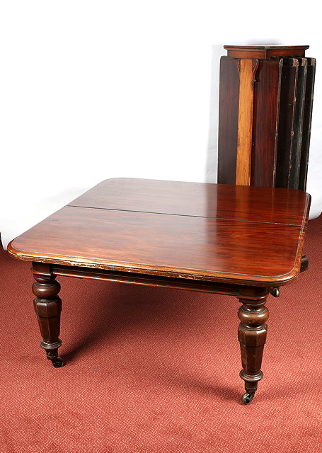 Appraisal: A VICTORIAN MAHOGANY EXTENDING DINING TABLE the rectangular top with