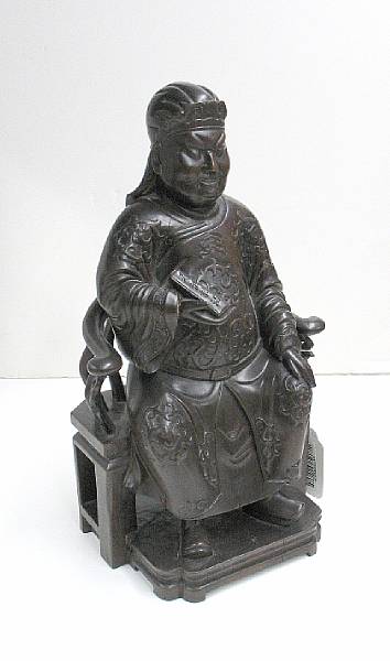 Appraisal: A carved wood seated Daoist figure Late Qing Dynasty Depicting