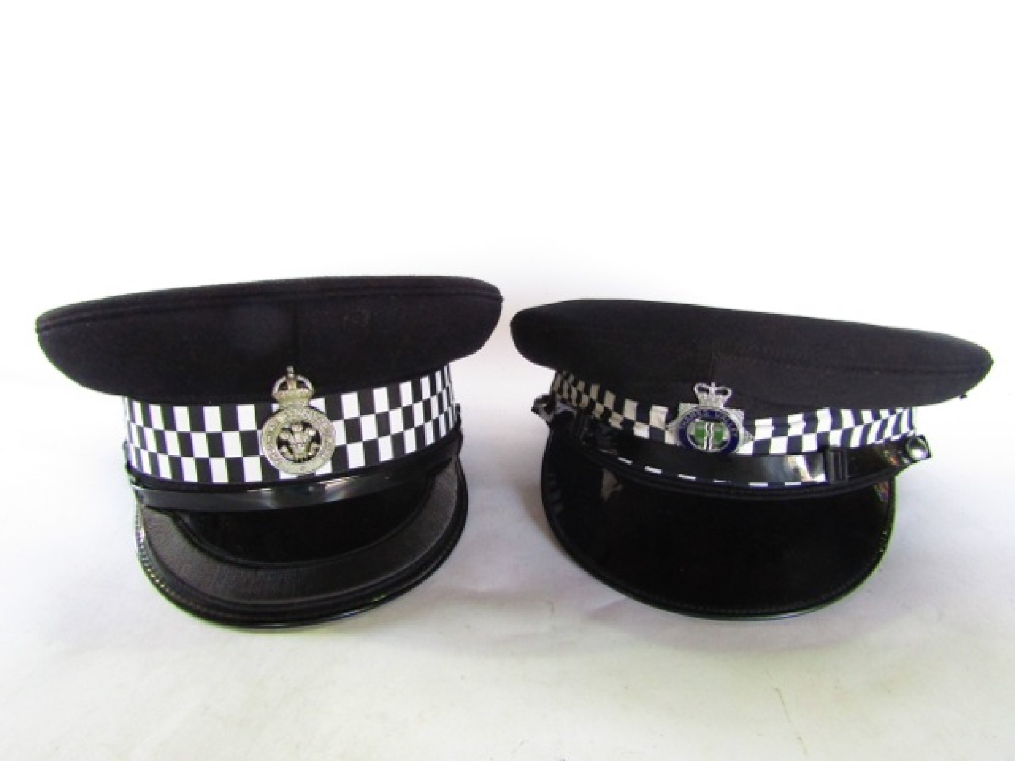 Appraisal: Two police caps one bearing a badge for Cheshire Constabulary