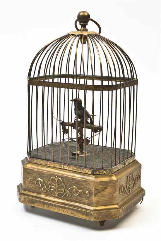 Appraisal: A Singing Bird Automaton set in a cage stamped Made