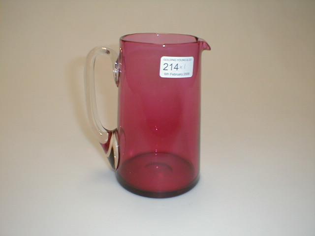 Appraisal: A cranberry glass straight sided water jug with a clear