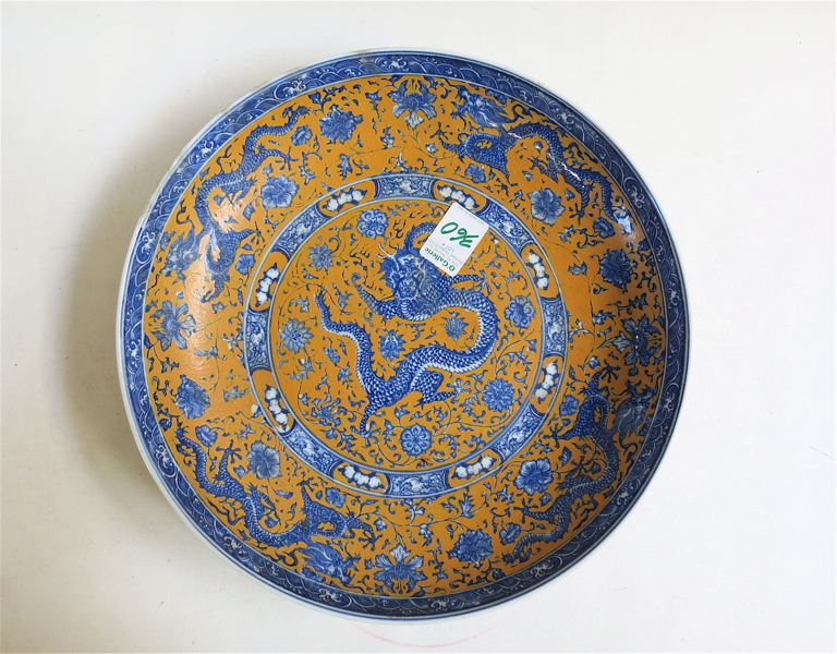 Appraisal: CHINESE PORCELAIN BOWL with blue underglaze dragons and flowers decoration