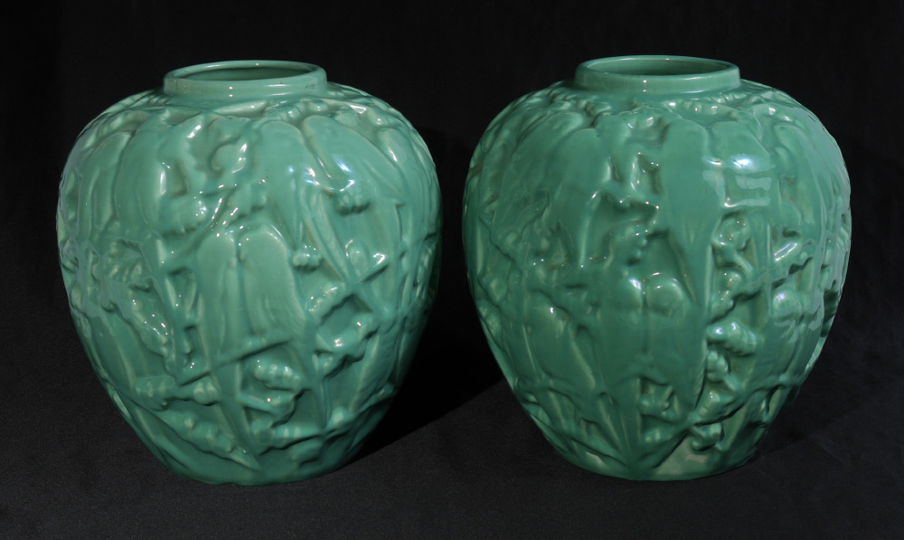 Appraisal: PAIR POTTERY LOVEBIRD PARAKEET VASES Green glaze very similar design