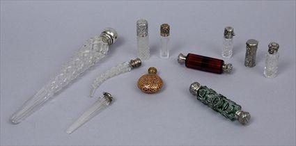 Appraisal: GROUP OF NINE SILVER-LIDDED GLASS SCENT BOTTLES ANOTHER BOTTLE AND