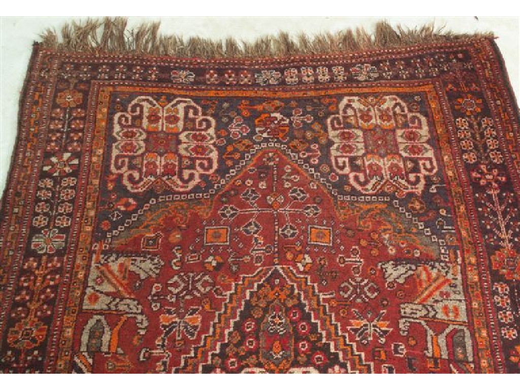 Appraisal: SHIRAZ RUG with a lozenge shape central medallion and a