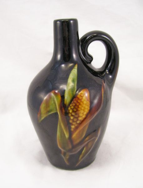 Appraisal: Pottery Jug Dark brown pottery glaze with a hand painted