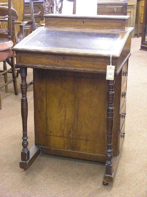 Appraisal: A mid Victorian inlaid rosewood Davenport with stationery compartment above