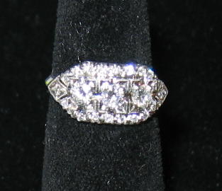 Appraisal: PLATINUM DIAMOND RING Set with three round brilliant cut diamonds