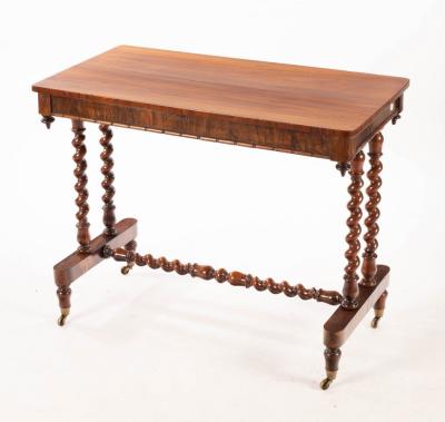 Appraisal: A Victorian rosewood side table on twist turned supports cm