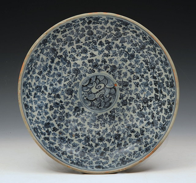 Appraisal: A CHINESE PROVINCIAL BLUE AND WHITE SHALLOW CHARGER with allover