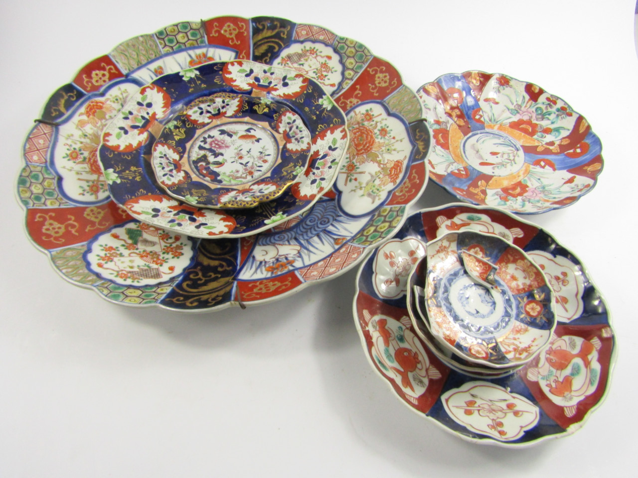 Appraisal: A Japanese fluted Imari dish decorated with panels of birds