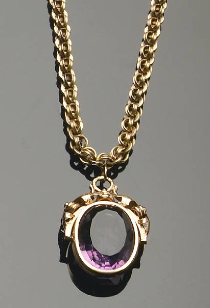 Appraisal: A gold chain with amethyst and gold fob pendant stamped